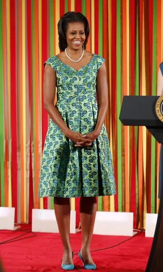 How Michelle Obama Spent Her Week - First Lady Michelle Obama gave 54 child chefs a memory they'll keep for a lifetime — a kids' state dinner at the White House. Obama was was also a guest editor for iVillage and dished about her morning workout. —Joyce Jones  (Photo: REUTERS/Larry Downing)