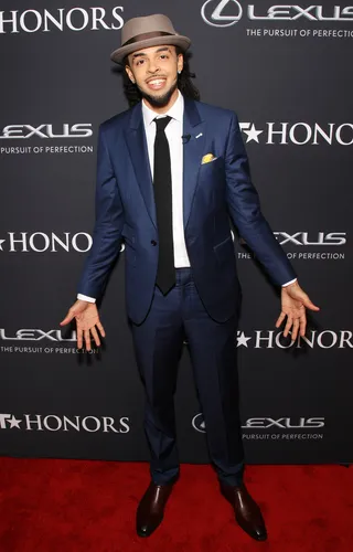 A1  - Rapper Dee-1 swags in his suit and tie look that he paired with a dope fedora.&nbsp; (Photo: Bennett Raglin/BET/Getty Images for BET)