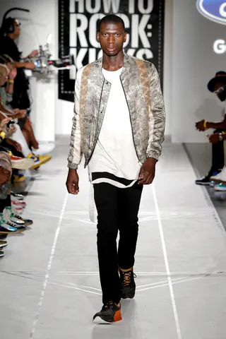 Style's in Session - Turn up your white tee street style with a dope designer jacket and even doper kicks.CREDITS:• Siki IM brocade bomber jacket• Stampd cream strap shirt• J. Lindeberg black denim jeans• New Balance 1500 charcoal/orange sneakers(Photo: JP Yim/Getty Images)