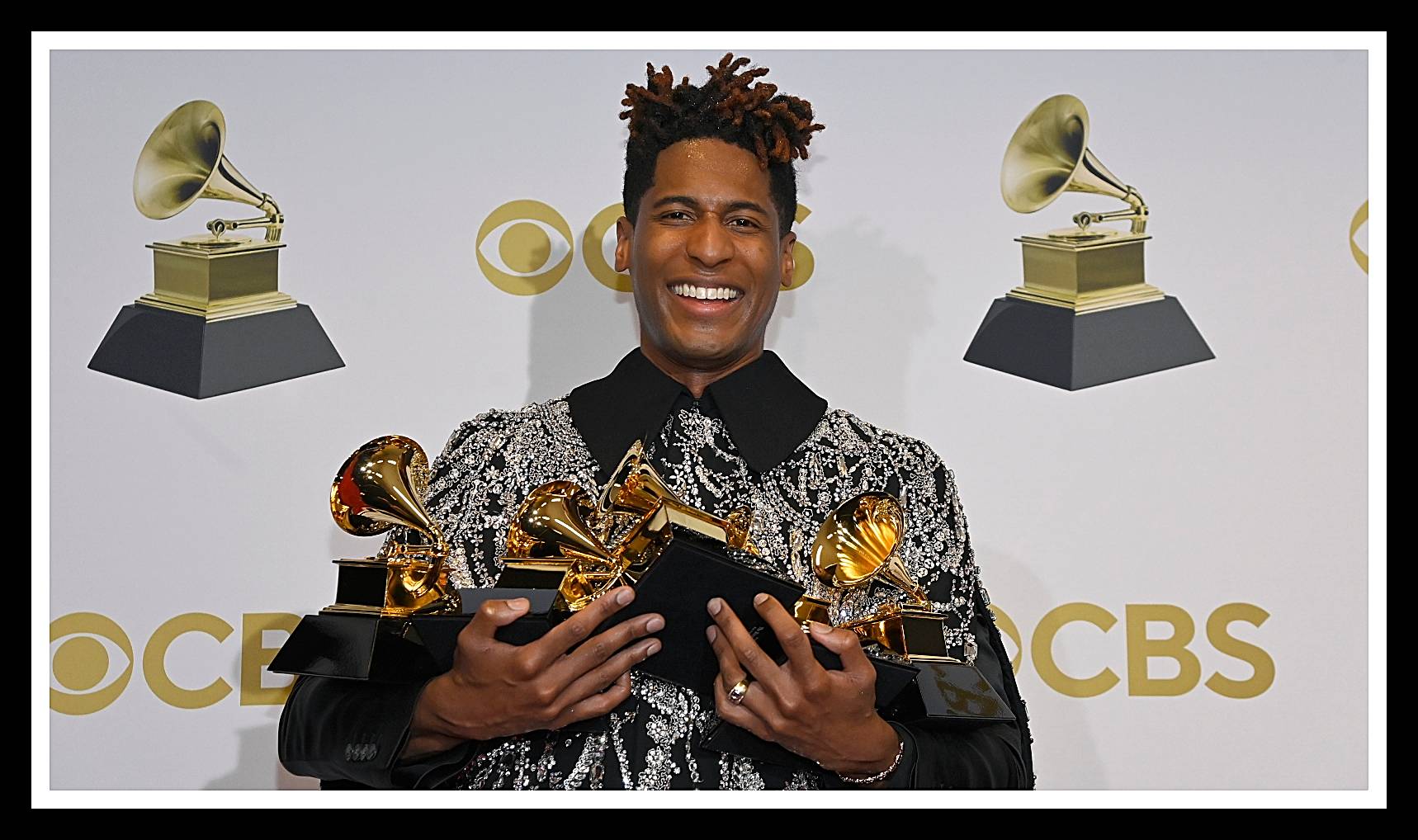 APRIL 03: Jon Batiste winner of best American roots performance, best American roots song, best music video and best score soundtrack for visual media poses in the winners photo room during the 64th Annual GRAMMY Awards at MGM Grand Garden Arena on April 03, 2022 in Las Vegas, Nevada.  