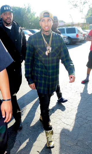 Throwbacks - Rapper Tyga&nbsp;was out and about with his boys in West Hollywood rocking a pair of gold LA Gear sneakers.(Photo: WENN.com)