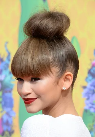Hot Bun - Warning: topknot envy head! We’re still smitten with the starlet’s voluminous bun-and-fringe combo she rocked to last year’s Kids Choice Awards.  (Photo: Frazer Harrison/Getty Images)