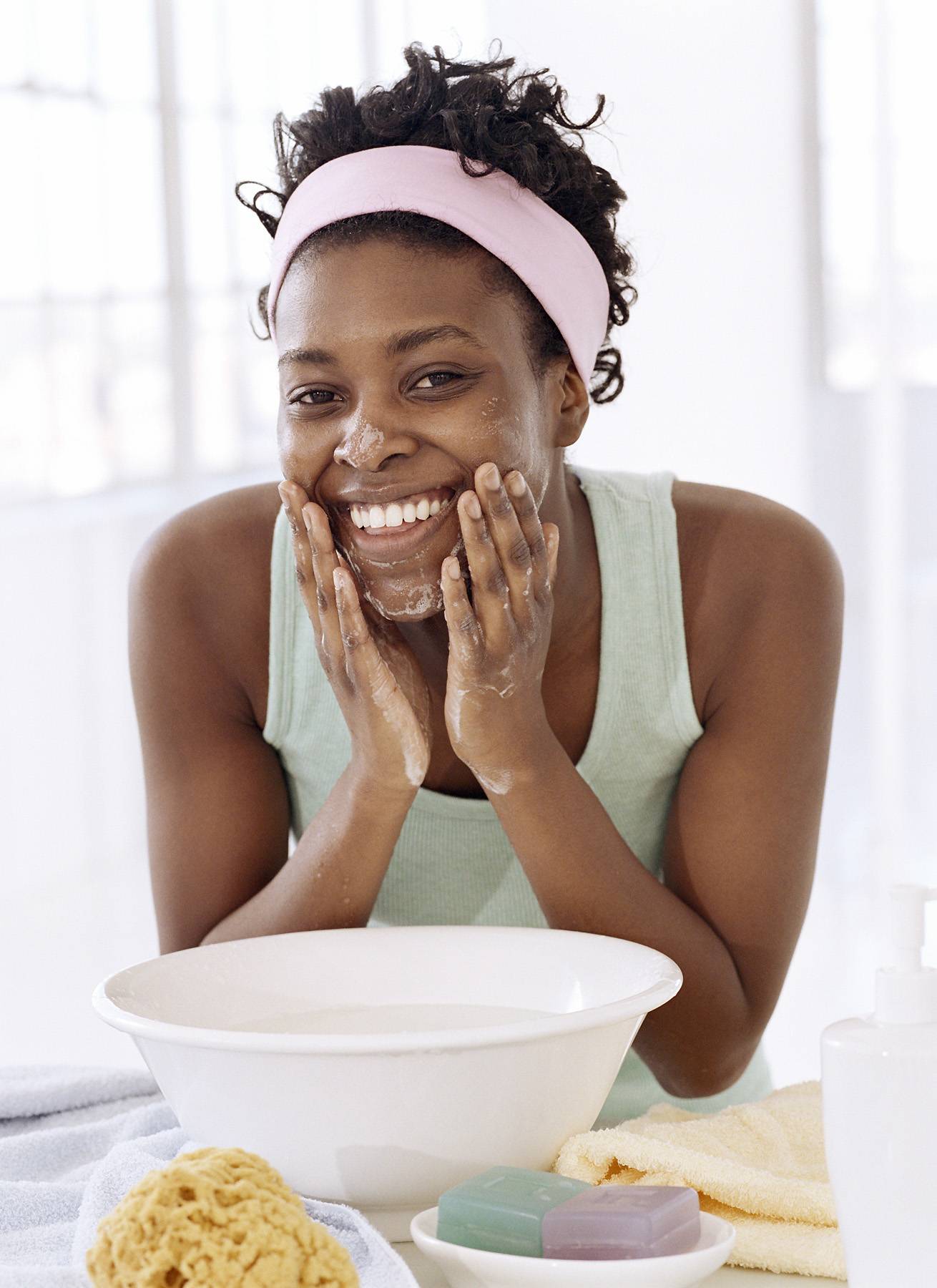 woman washing her face