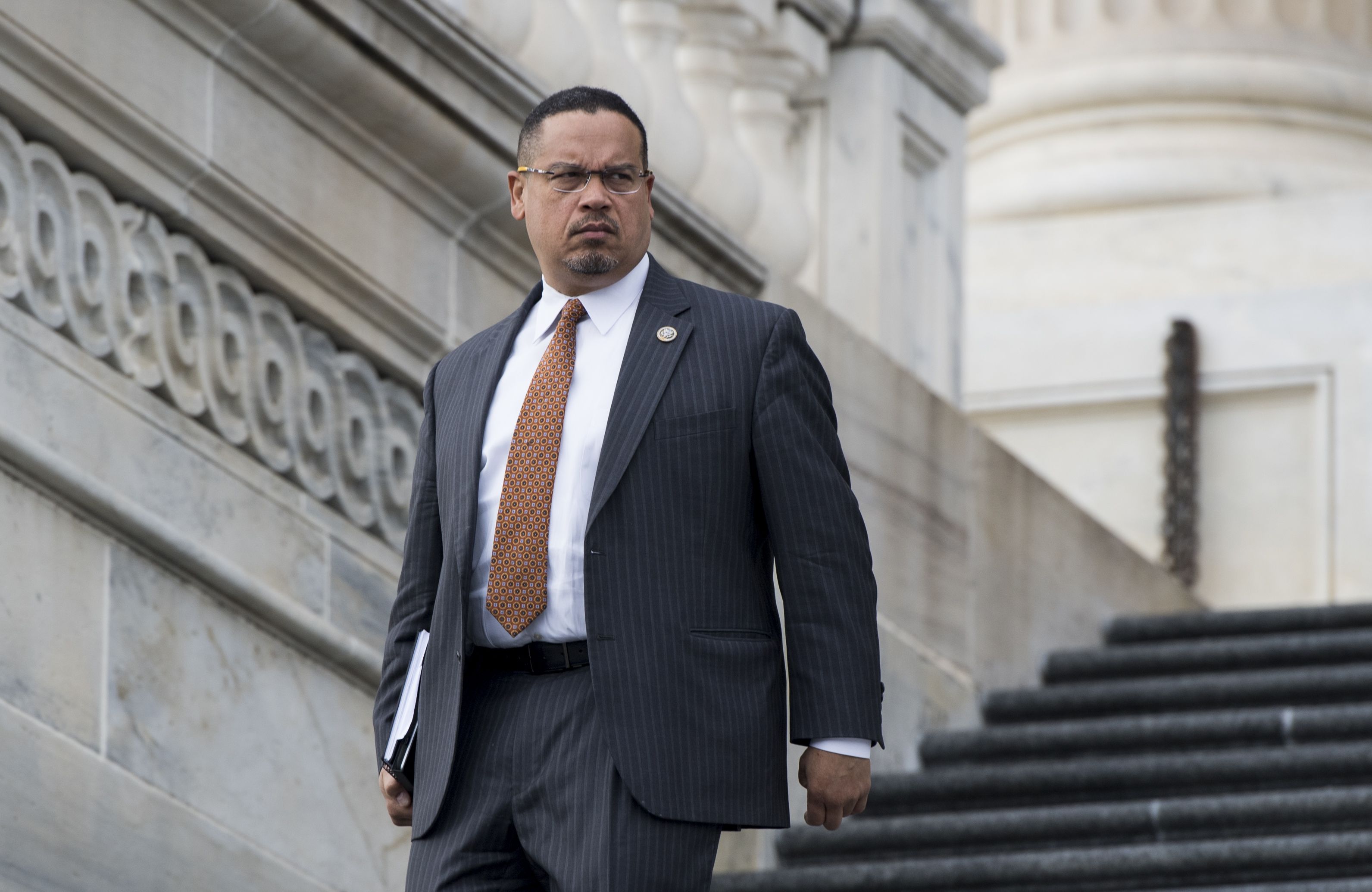 UNITED STATES - JANUARY 11: Rep. Keith Ellison, D-Minn., walks down the House steps after the final votes of the week on Thursday, Jan. 11, 2018. (Photo By Bill Clark/CQ Roll Call)