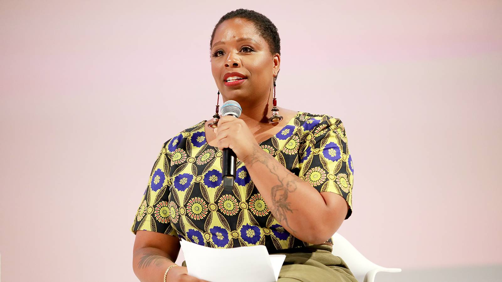 Patrisse Cullors speaks on stage 