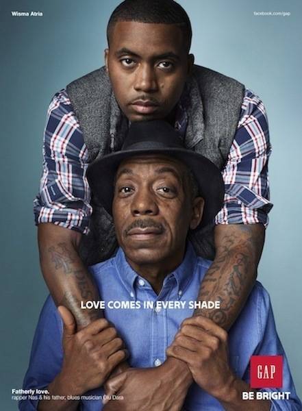 Bridging the Gap: Music Stars in Gap Ads - Hip hop continues to break down walls. Nas and his father, jazz-blues musician Olu Dara, are featured together in a new Gap holiday ad campaign called "Love Comes in Every Shade." Their ad and poster, called "Fatherly Love," features them embracing. It's another impactful ad for Gap, which was an early adopter in embracing hip hop and soul stars for its marketing. Click on to check out some of the other music stars who have appeared in landmark ads for the apparel company.  (Photo: Courtesy Gap)