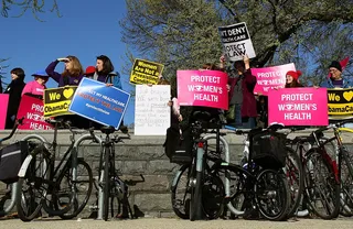 Americans Divided - Demonstrators for and against the health care reform law made their cases outside the Supreme Court building. Supporters say the law saves lives and everyone pays for the uninsured’s health care costs. Opponents argue that government should not be allowed to force individuals to buy anything. Where would it end? they ask.(Photo: Mark Wilson/Getty Images)