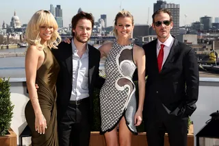 Group Hug - Rihanna and her co-stars Taylor Kitsch and Brooklyn Decker pose with Battleship director Peter Berg.  (Photo: Dave Hogan/Getty Images)