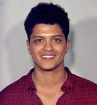 Bruno Mars - A cheesing Bruno Mars had his mug shot taken in 2013 after being arrested in Las Vegas for drug charges.(Photo: AP/File)