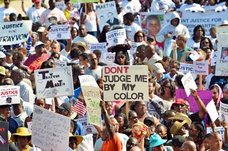 Powerful Scene - The crowd of protesters use signs to send Sandford county commissioners a message over the handling of Trayvon’s death. (Photo: Roberto Gonzalez/Getty Images)