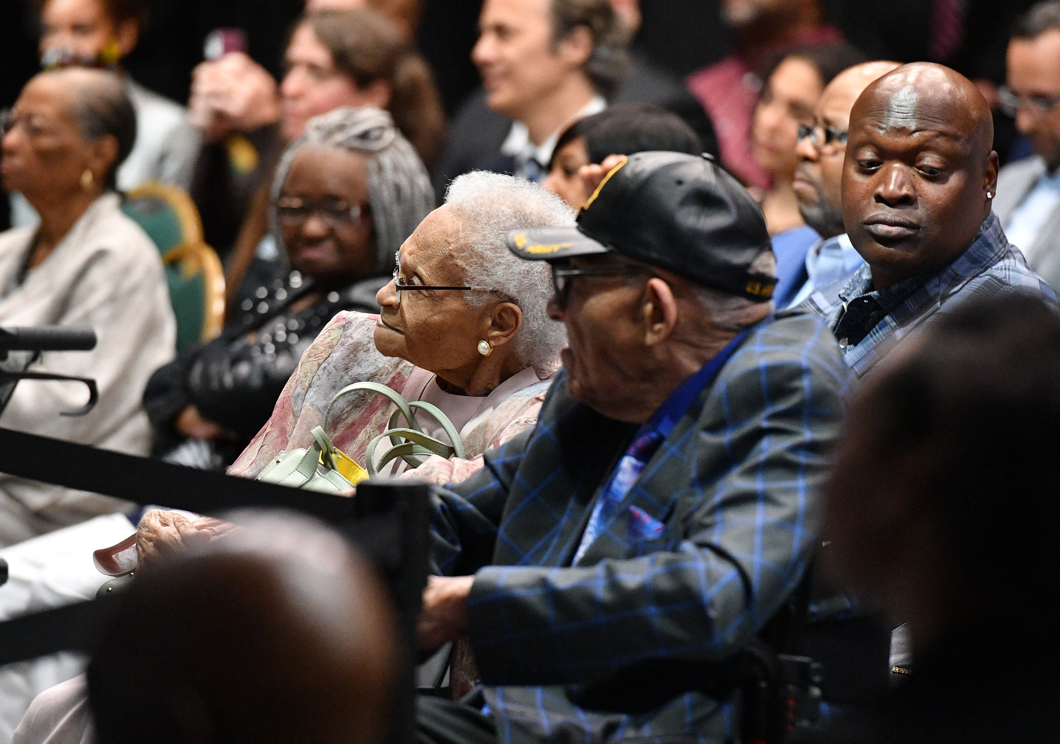 Tulsa race massacre Survivors Viola Fletcher (C)  and Hughes Van Ellis (C R) listen to US President Joe Biden as he speaks on the 100th anniversary of the Tulsa Race Massacre at the Greenwood Cultural Center in Tulsa, Oklahoma on June 1, 2021. - US President Joe Biden traveled Tuesday to Oklahoma to honor the victims of a 1921 racial massacre in the city of Tulsa, where African American residents are hoping he will hear their call for financial reparations 100 years on. (Photo by MANDEL NGAN / AFP) (Photo by MANDEL NGAN/AFP via Getty Images)