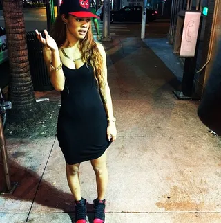 Teyana Taylor  - The self-proclaimed tomboy is all woman in her second-skin tank dress teamed with a Wutang Brand Limited fitted and red-and-black dunks.  (Photo: Teyana Taylor via Instagram)