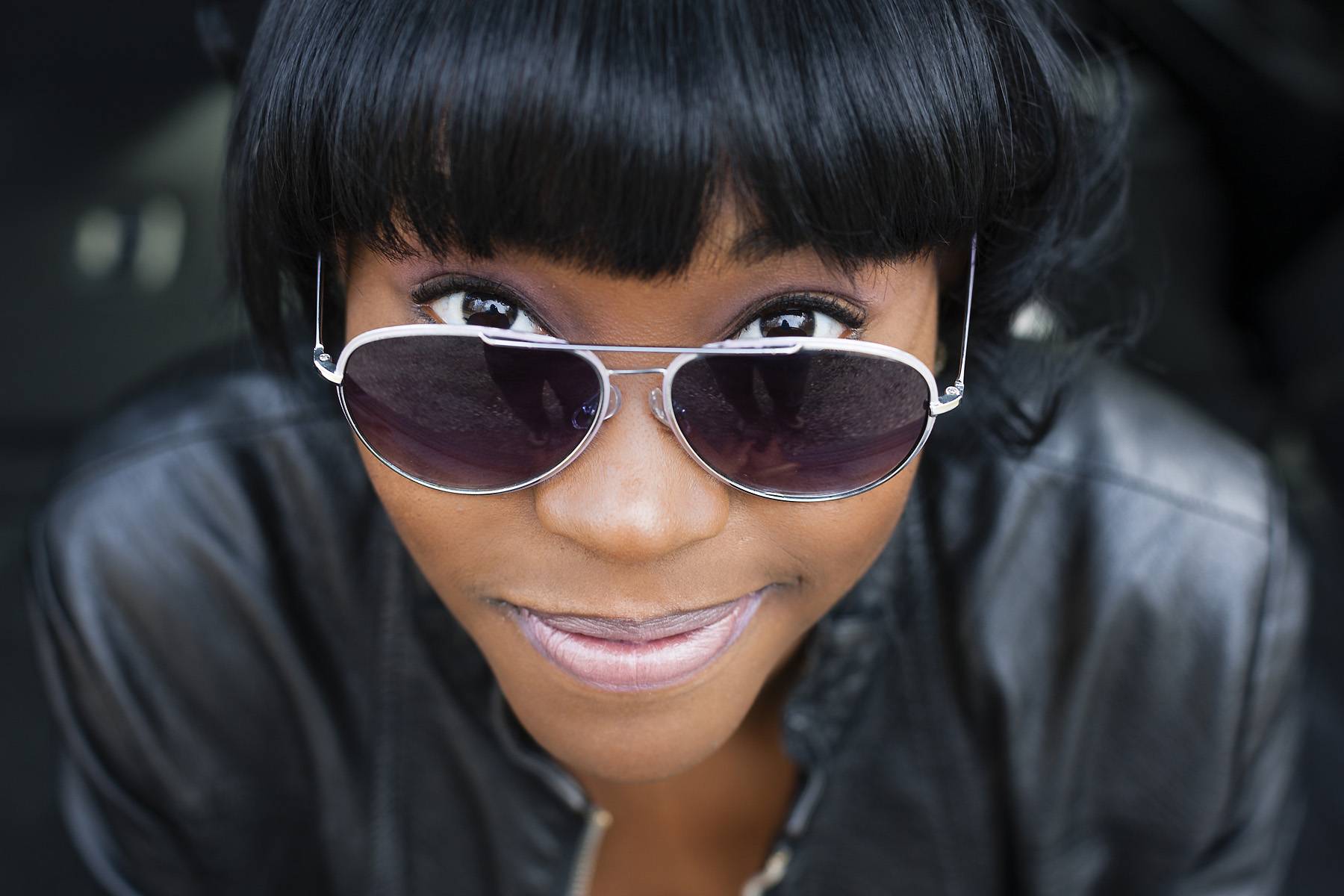 woman smiling with sunglasses on