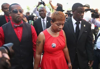 A Mother's Pain&nbsp; - Lesley McSpadden (C) arrives at Friendly Temple Missionary Baptist Church for the funeral of her son Michael Brown.&nbsp;(Photo: Scott Olson/Getty Images)
