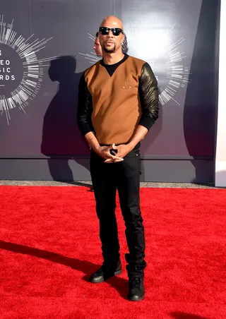 Common - The rapper and actor keeps it low-key with a little bit of edge in a leather-sleeved sweater and black jeans.&nbsp;  (Photo: Jason Merritt/Getty Images for MTV)