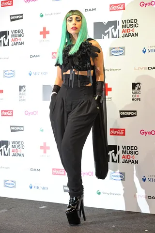 Lady Gaga - The avant-garde fashionista breaks up her black featherd top and pants ensemble with a longer version of her newly sea green hair.(Photo: Andrew McGovern/PictureGroup)