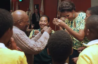 Pounds - Obama and Tutu fist bump during the event.(Photo: AP Photo/Charles Dharapak, Pool)