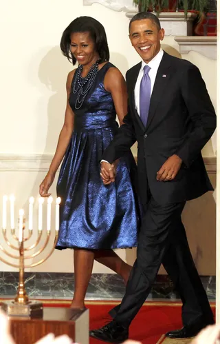 Michelle Obama&nbsp;  - Mrs. O donned a metallic blue dress adorned with strands of black layered pearls by Erickson Beamon. Pretty!(Photo: KEVIN LAMARQUE/LANDOV)