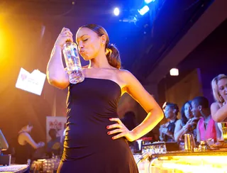 Drinks Flowing - Our mixologist Jenny seems to be in love. (Photo: Moses Mitchell/BET)