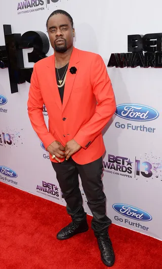 Pop O' Color - MMG artist Wale rocks a red blazer over an all-black ensemble.   (Photo: Jason Merritt/BET/Getty Images for BET)