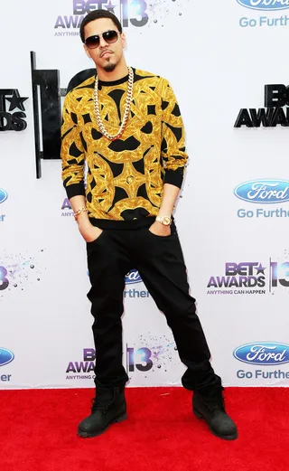 Hip Hop Honors - Hip Hop artist J. Cole rocks a popular Versace sweatshirt (both DJ Drama and Brandon T. Jackson were spotted wearing it as well) on the red carpet of the 2013 BET Awards.  (Photo: Frederick M. Brown/Getty Images for BET)