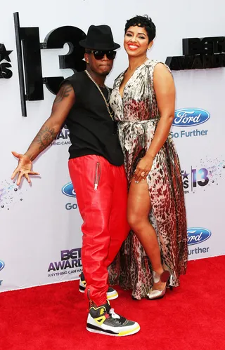 Double the Trouble - Ne-Yo and his artist&nbsp;RaVaughn steal the spotlight at the 2013 BET Awards. He chooses red leather pants and she picks a flowing cheetah-print gown.  (Photo: Frederick M. Brown/Getty Images for BET)