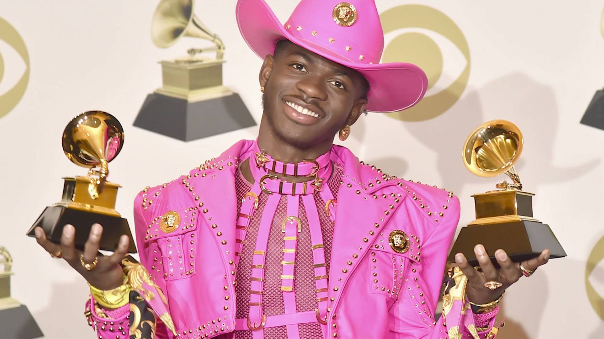 Lil Nas X holding 2 Grammys