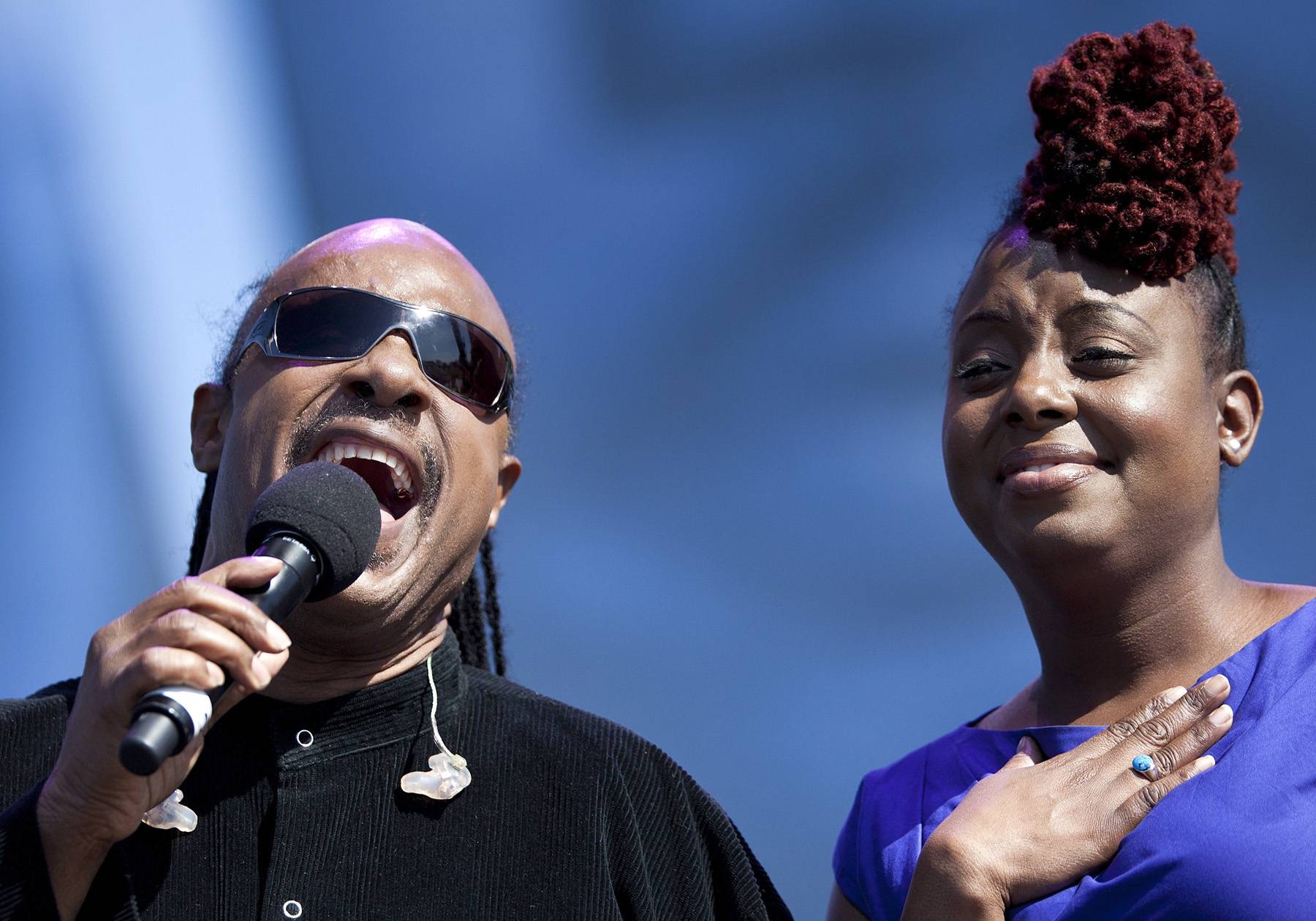 Stevie Wonder and Ledisi - The legendary Stevie Wonder, who, in 1980, successfully campaigned to make Dr. Martin Luther King Jr.'s birthday a national holiday with the original song &quot;Happy Birthday,&quot; joins Grammy-nominated recording artist Ledisi to sing &quot;It's A Wonderful World&quot; during the dedication ceremony for the Martin Luther King Jr. Memorial on the National Mall, on October 16, 2011, in Washington, DC.&nbsp; Ledisi was so moved, she had to take a moment during the song as she looked out at the crowd filled with President Barack Obama and the first family, other entertainers, civil rights leaders and gracious attendees. (Photo: Brendan Smialowski/Getty Images)