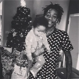 Wiz Khalifa @mistaercap - "Best gift ever." Wiz makes baby Bash's first Christmas unforgettable. Look at all those presents under the tree!(Photo: Wiz Khalifa via Instagram)