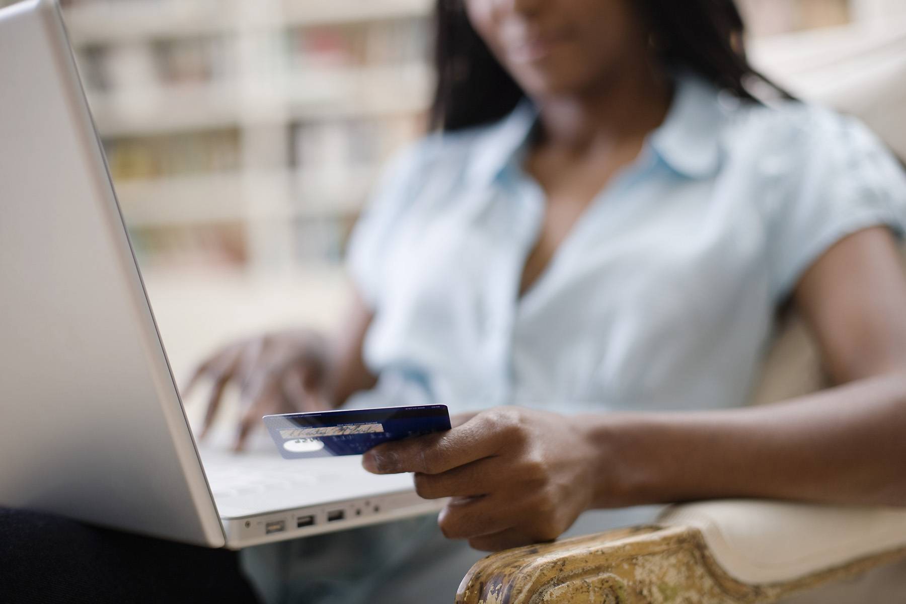 woman shopping online with credit card