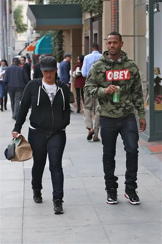 Message in the Fashion - Marlon Wayans walks with a friend in Beverly Hills wearing artist Shepard Fairey's "Obey" hoodie. (photo: WENN.com)