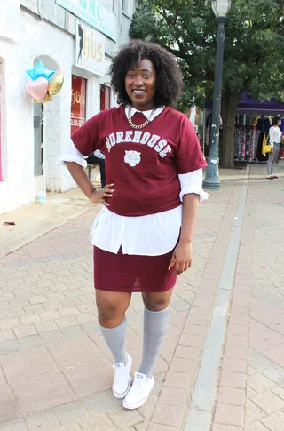 Fresh and Fly - Spelman College freshman Mo’esha Hicks styles her Morehouse tee with a button-up undershirt and knit maroon skirt. She adds gray knee-highs and white sneakers to finish the look.  (Photo: Britt Middleton)