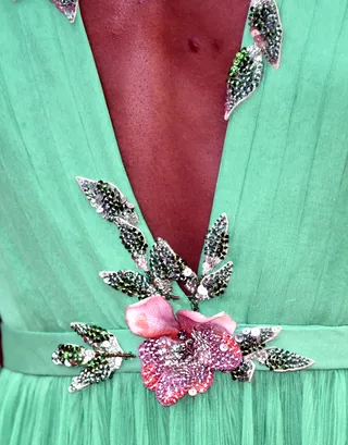 It's All in the Details - Let’s zoom in and check out this beading. This floral appliqué design accents her shoulders and waist and is studded with silver sequins.  (Photo: Clemens Bilan/Getty Images)