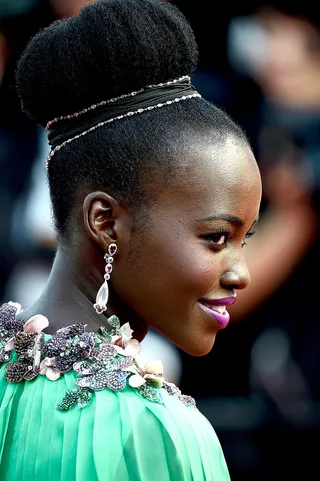 Royal 'Do - Are you living for this regal updo? We sure are. She adds a braided headband with gold and jewel accents to make it pop.  (Photo: Ian Gavan/Getty Images)