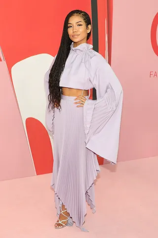 Jhene Aiko - Stay Ready!&nbsp;Jhene Aiko&nbsp;glowed as she took the red carpet at the 2019 CFDA Awards in a two-piece lavender Pyer Moss outfit paired with silver strappy sandals.(Photo: Taylor Hill/FilmMagic)