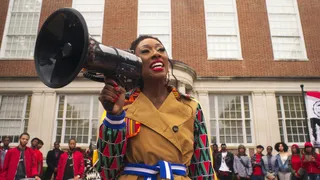 LaLa Milan gives directions on a megaphone. - (Photo: BET)