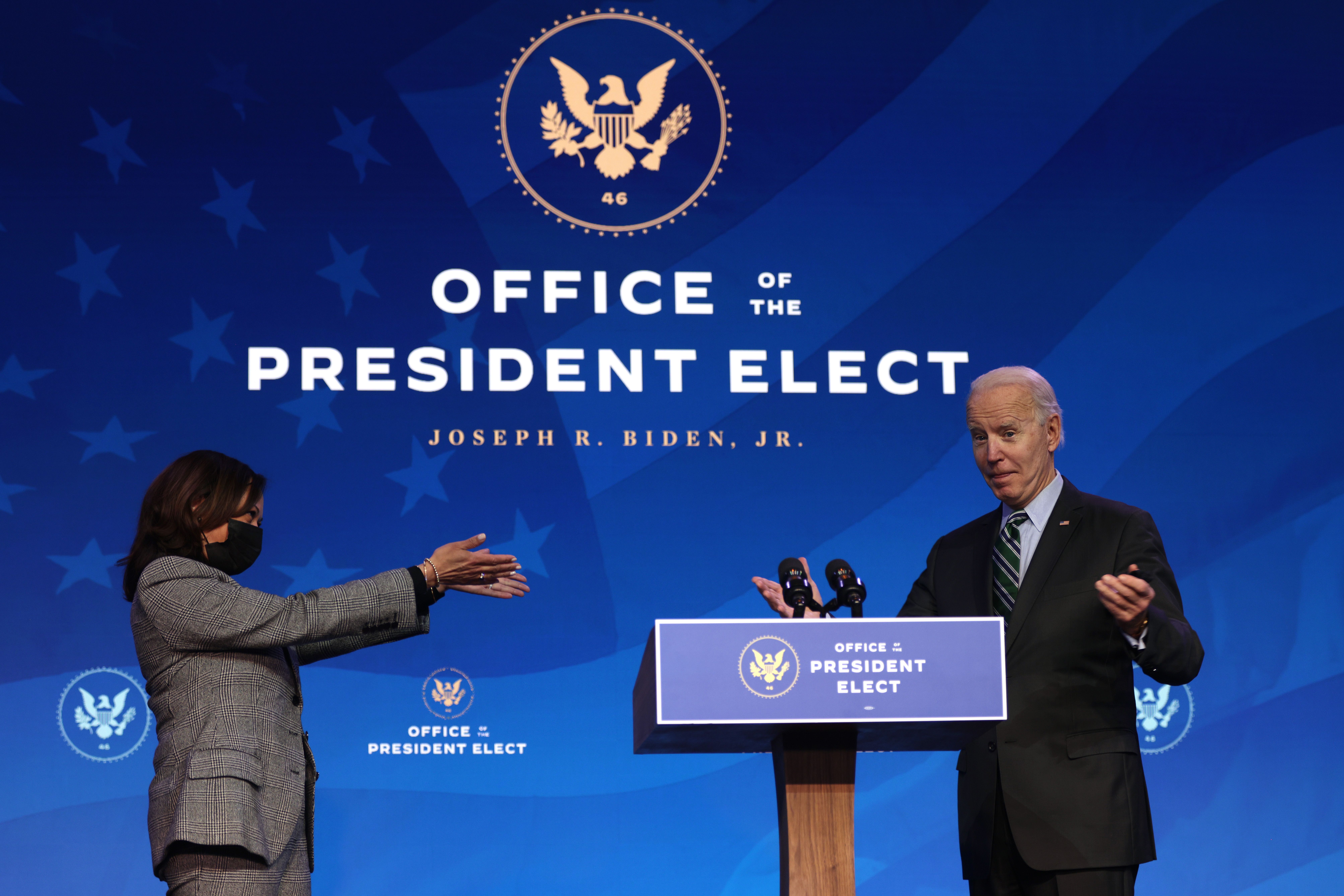 WILMINGTON, DELAWARE - JANUARY 16:  U.S. President-elect Joe Biden (R) and U.S. Vice President-elect Kamala Harris (L) gesture during an announcement January 16, 2021 at the Queen theater in Wilmington, Delaware. President-elect Joe Biden has announced key members of his incoming White House science team.  (Photo by Alex Wong/Getty Images)