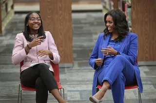 Darling in Denim&nbsp; - Michelle chatted with 20 high school senior girls at&nbsp;Whitney Young Magnet School in Chicago (Nov. 12) for the first stop of her Chicago book tour. She was all smiles donning in a casual yet chic denim suit by&nbsp;Akris suit paired with gray suede Stuart Weitzman pumps. (Photo: Scott Olson/Getty Images)&nbsp;