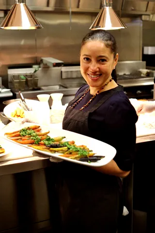 Impressive Results - One of the attendees of the afternoon cooking workshop proudly displays her beautiful dish.(Photo: Phelan Marc/BET)