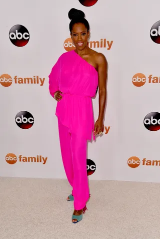 Light bright - She brings the party to the Disney ABC Television Group's 2015 TCA Summer Press Tour in this hotter-than-pink one-shoulder jumpsuit and topknot.&nbsp;  (Photo: Alberto E. Rodriguez/Getty Images)