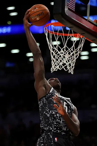 Going Up on a Friday - Gorgui Dieng put the World in the palm of his hands on this dunk and the U.S. didn't like it.&nbsp;(Photo: Elsa/Getty Images)