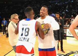 Dap It Up - Blake Leeper and Nick Cannon chop it up before getting into the game action.  (Photo: Brad Barket/Getty Images)