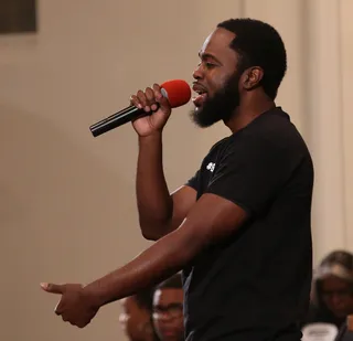 Still Standing - Spoken word talent Julian Thomas sets the tone for the event with his moving piece "Stand Up Black Man." (Photo: Bennett Raglin/BET/Getty Images for BET)