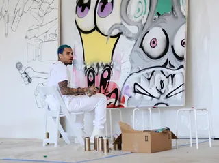 Art Therapy - Chris Brown takes a break from the grind by putting his mark on a canvas at SPACEBY3 during Fine Art Auctions Miami's Urban Art Week. (Photo: Sergi Alexander/Getty Images for Fine Art Auctions Miami)