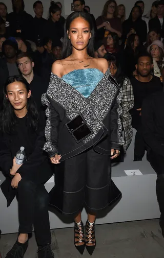 Cold Shoulder - Rihanna sits — or stands — front row at Kanye West's Adidas x Kanye West Yeezy Fashion Show days after the rapper announced he will be executive producing RiRi's upcoming album. (Photo: Dimitrios Kambouris/Getty Images for adidas)