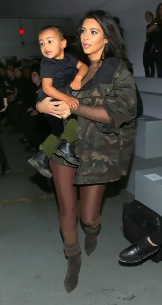 Yeezy's Favorite Girls - Camo-clad Kim Kardashian and daughter North West brave the NYC cold to support Kanye West's first fashion show during New York Fashion Week.&nbsp;(Photo: Brian Prahl / Splash News)