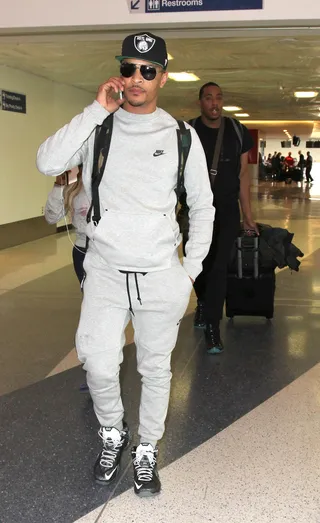Comfy Traveler - T.I.&nbsp;dressed in sweats and chatting on his phone preps for a flight out of Los Angeles International Airport.(Photo: Splash&nbsp;News)