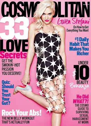 Gwen Stefani&nbsp;on Cosmopolitan - The “Spark the Fire” singer is h-o-t in a star-spangled look featuring a lace corset mini dress and silver Louboutin pumps.&nbsp;  (Photo: Cosmopolitan Magazine, March 2015)