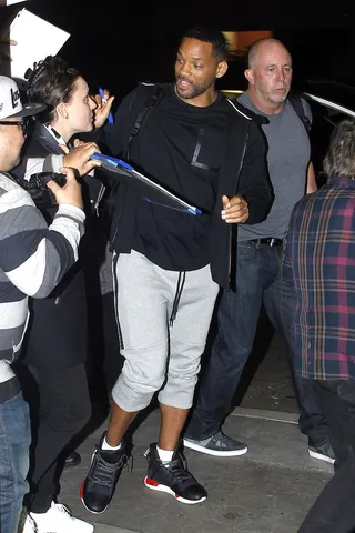 Fandemonium - Will Smith makes his way through a swarm of fans at LAX Airport in Los Angeles.(Photo: JGonzalez, PacificCoastNews)
