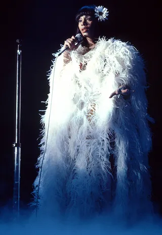 Drama Queen - Summer performing in all her dramatic glory and a cascade of soft white feathers.(Photo: Richie Aaron/Redferns/Getty Images)